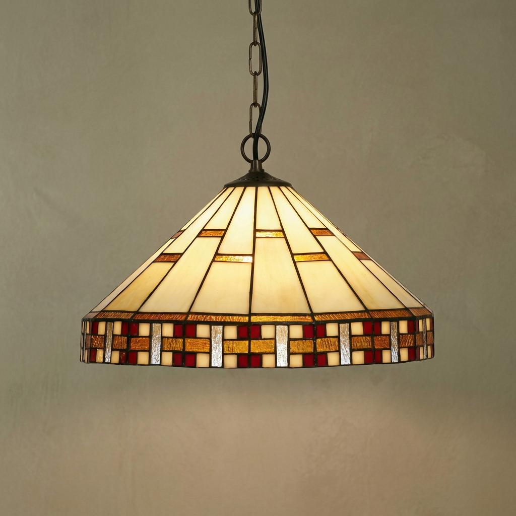 Geometric Tiffany ceiling pendant light with a cream, red, and gold stained glass shade suspended from a dark chain.