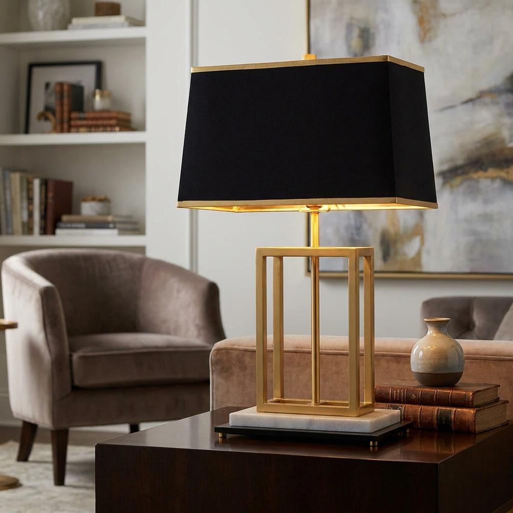 Atlas 1 Light table lamp with a brushed brass geometric base and black shade in a modern living room.