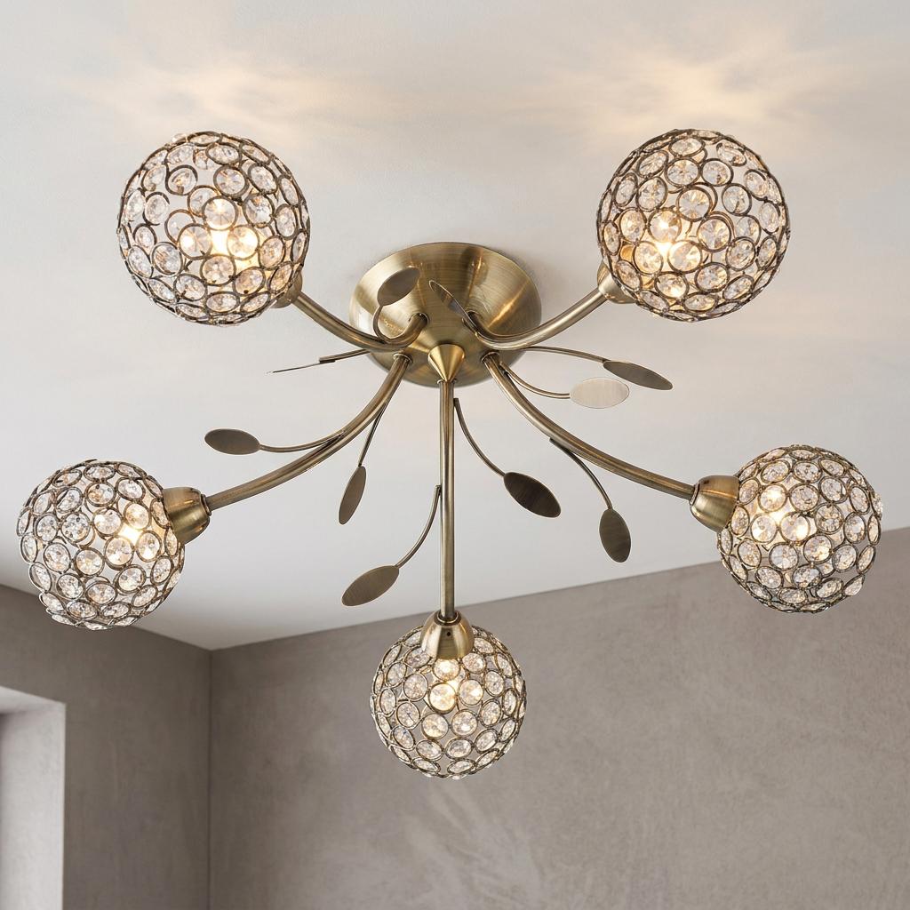 Bellis II 5-light brass ceiling light with crystal globes and decorative leaf accents mounted on a white ceiling.