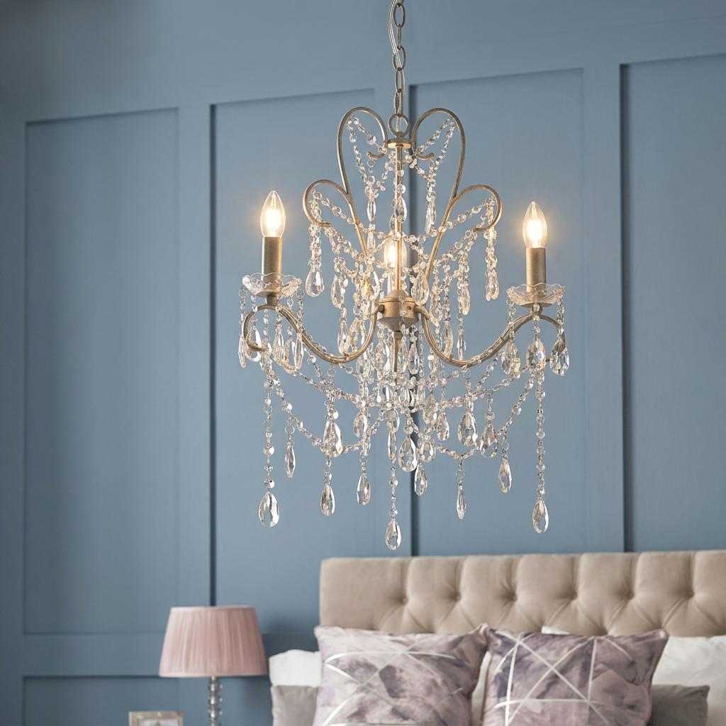 Berkley 3-light antique silver pendant chandelier with crystal droplets in a bedroom setting.