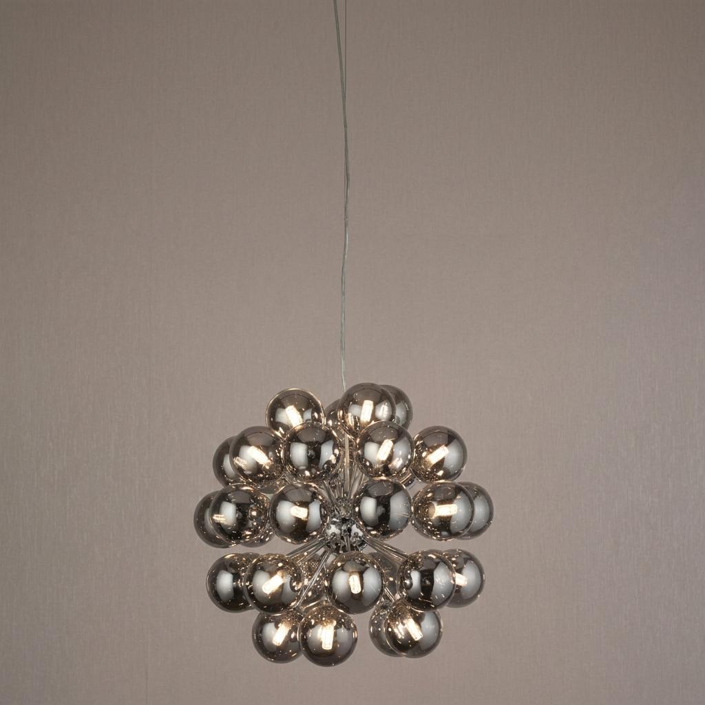 Modern 27-light chrome ceiling pendant with a cluster of smoked glass spheres against a textured grey wall.