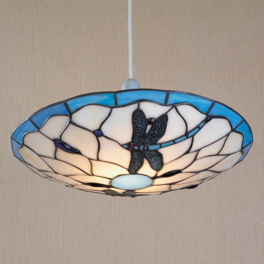A disc-shaped Tiffany lamp shade with blue dragonflies and stained glass, hanging from a white cord.
