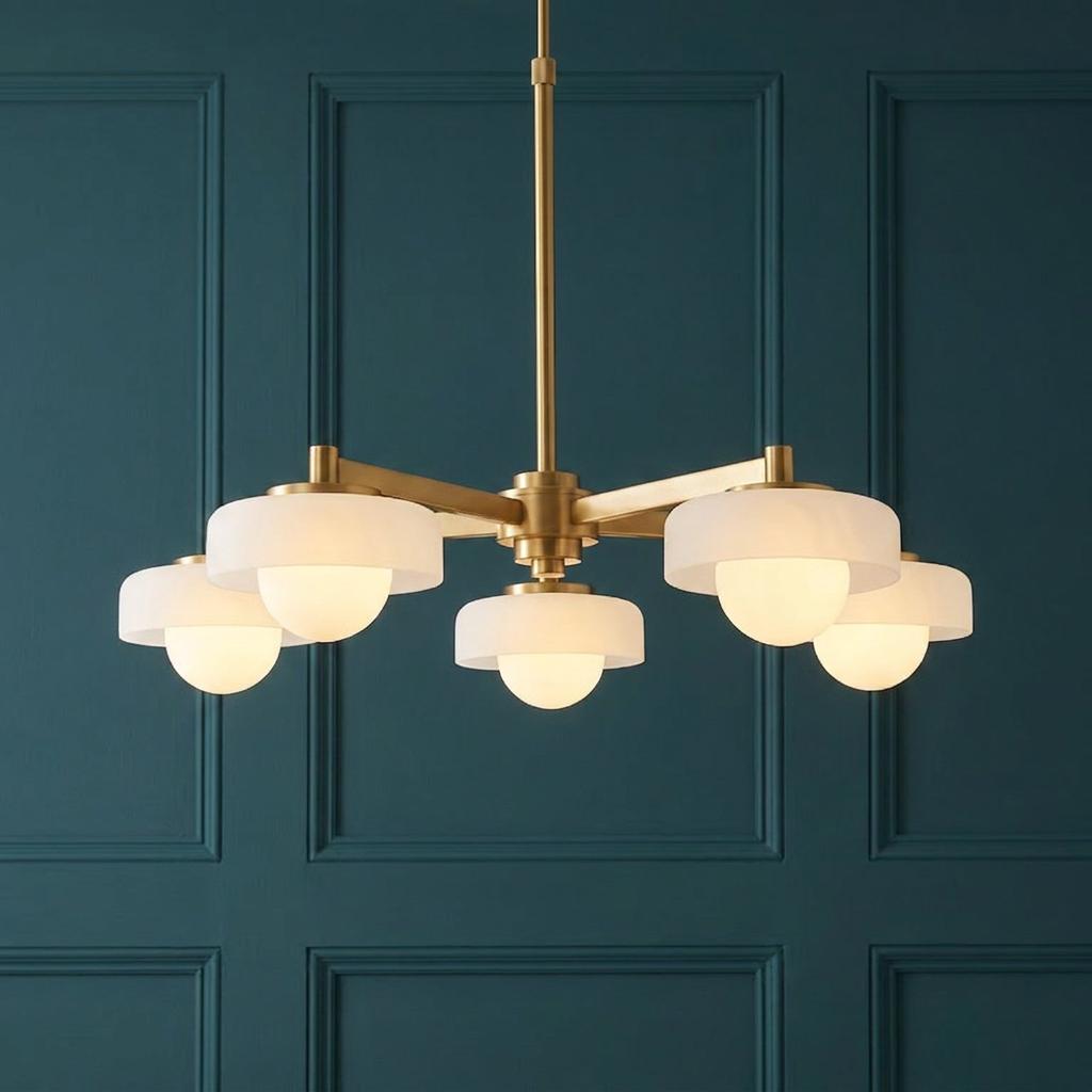 Boss 5-light brass pendant with opal glass shades against a teal paneled wall.
