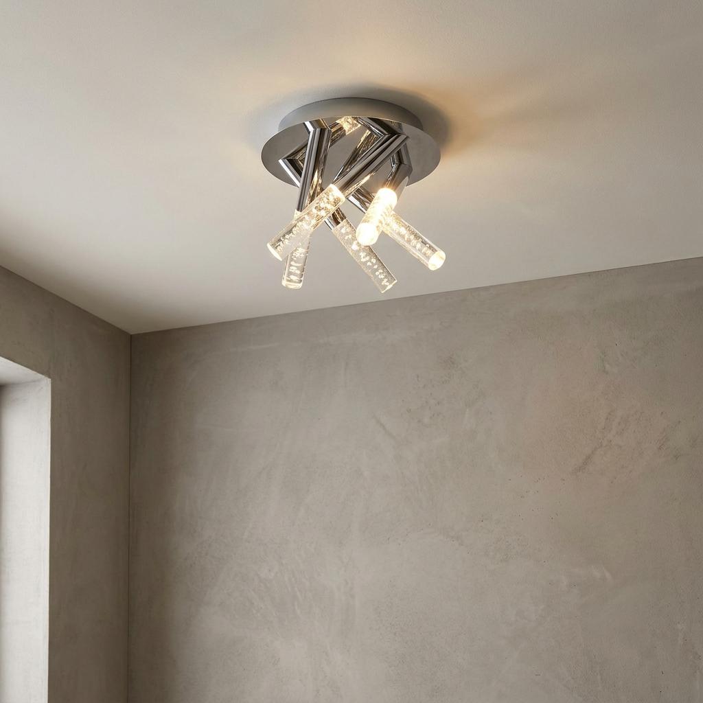 Modern 5-light chrome flush mount ceiling fixture with clear bubble-effect glass cylinders.