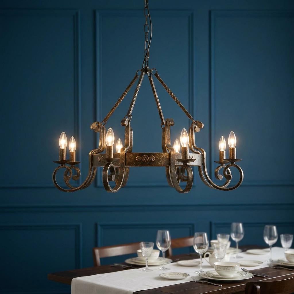 Carlisle 8-light brushed gold chandelier hanging above a formal dining table against a blue wall.