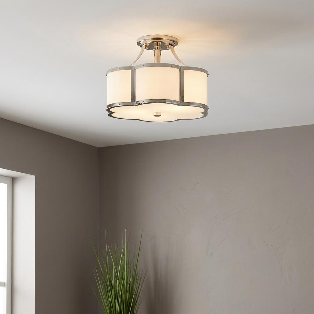 Polished nickel semi-flush ceiling light with white scalloped glass shades mounted on a white ceiling.