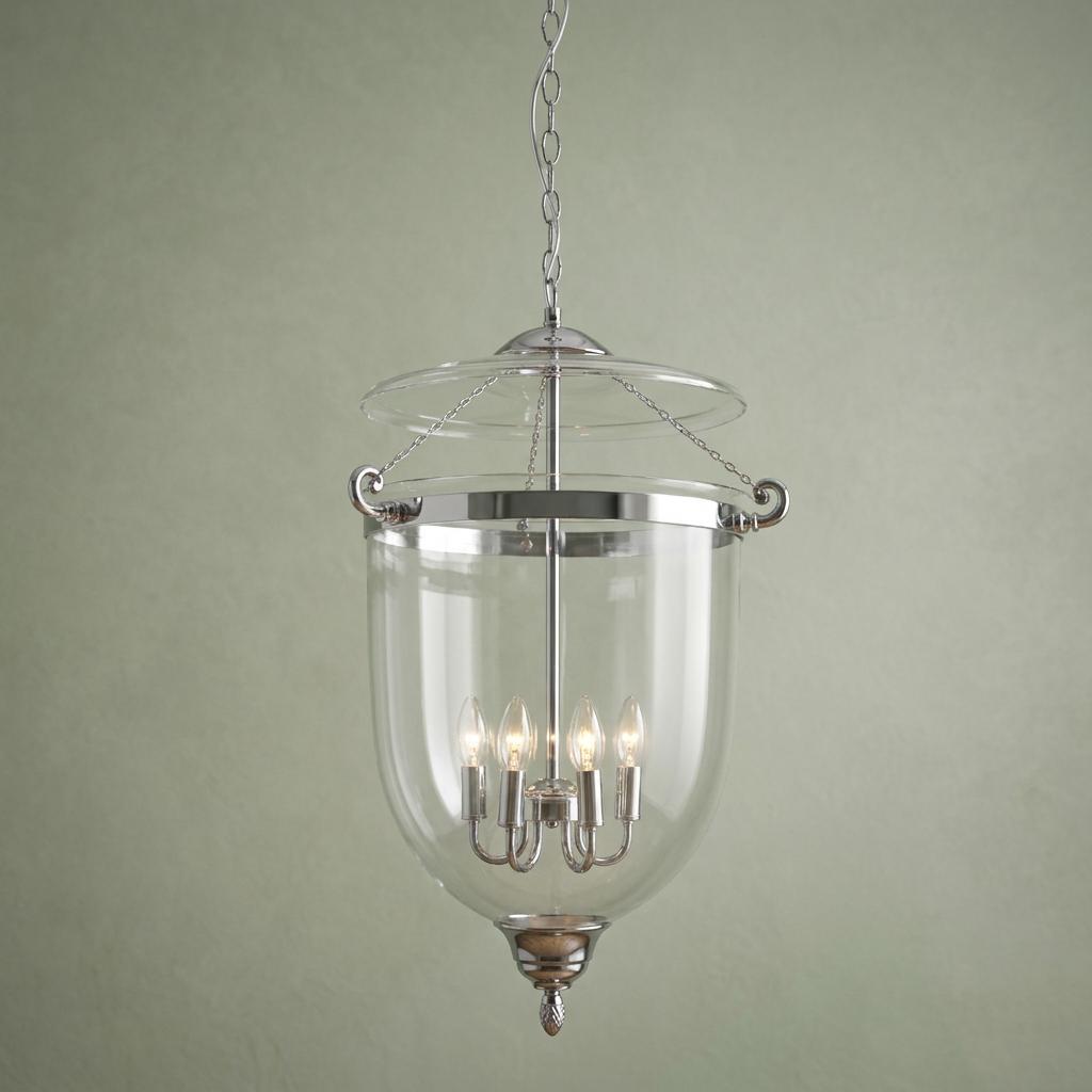 Chrome Georgian six-light bell lantern with clear glass shade hanging against a pale green wall.