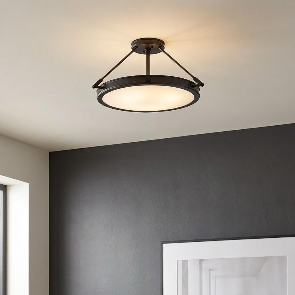 Collier black medium semi-flush ceiling light with a circular glass diffuser mounted on a white ceiling.