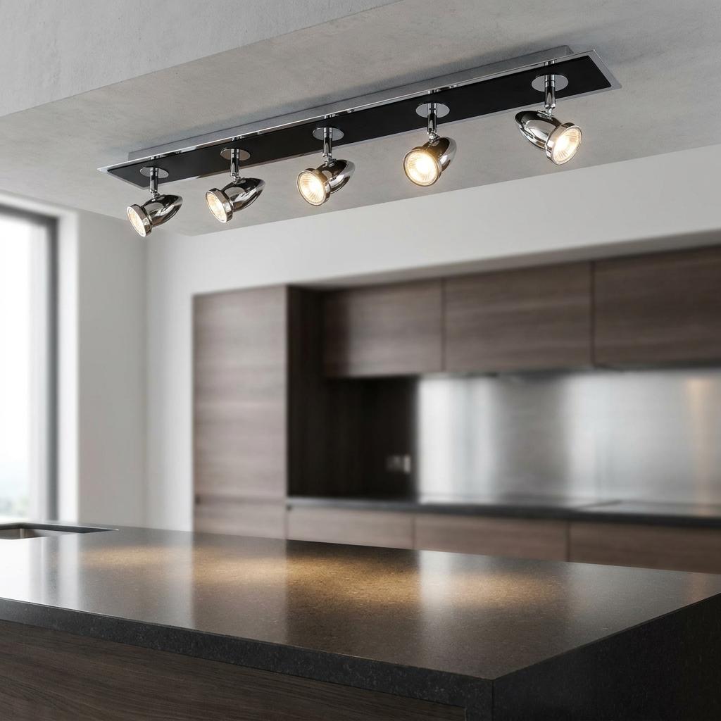 Comet 5 Light Bar Chrome and Black adjustable spotlights illuminate a modern kitchen island.