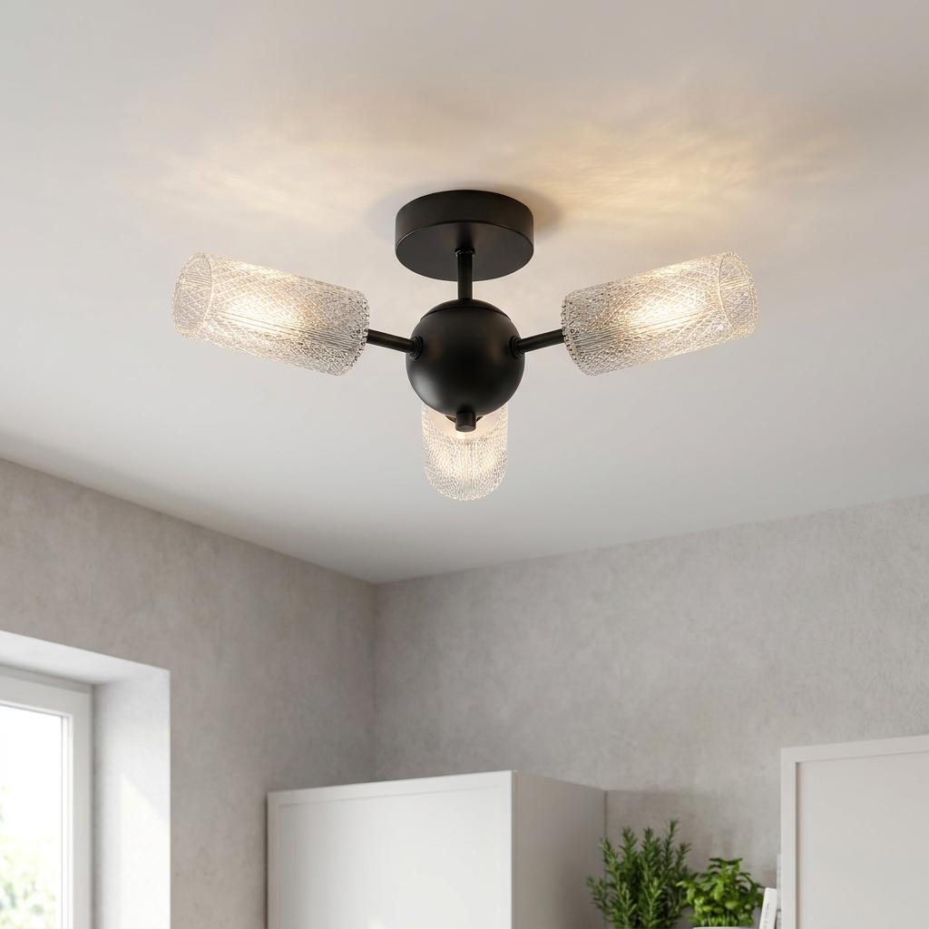 Modern black three-arm semi-flush ceiling light with lit textured acrylic shades mounted on a white ceiling.