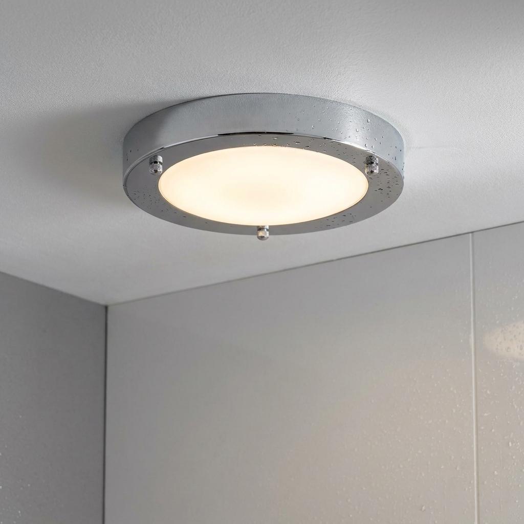 Circular Dublin bathroom chrome flush ceiling light with a frosted diffuser and water droplets on the frame.