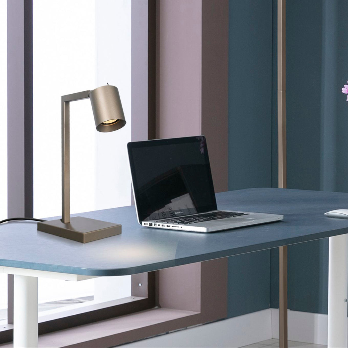 Office latte desk lamp on a home office desk with laptop, flowers and matching floor lamp