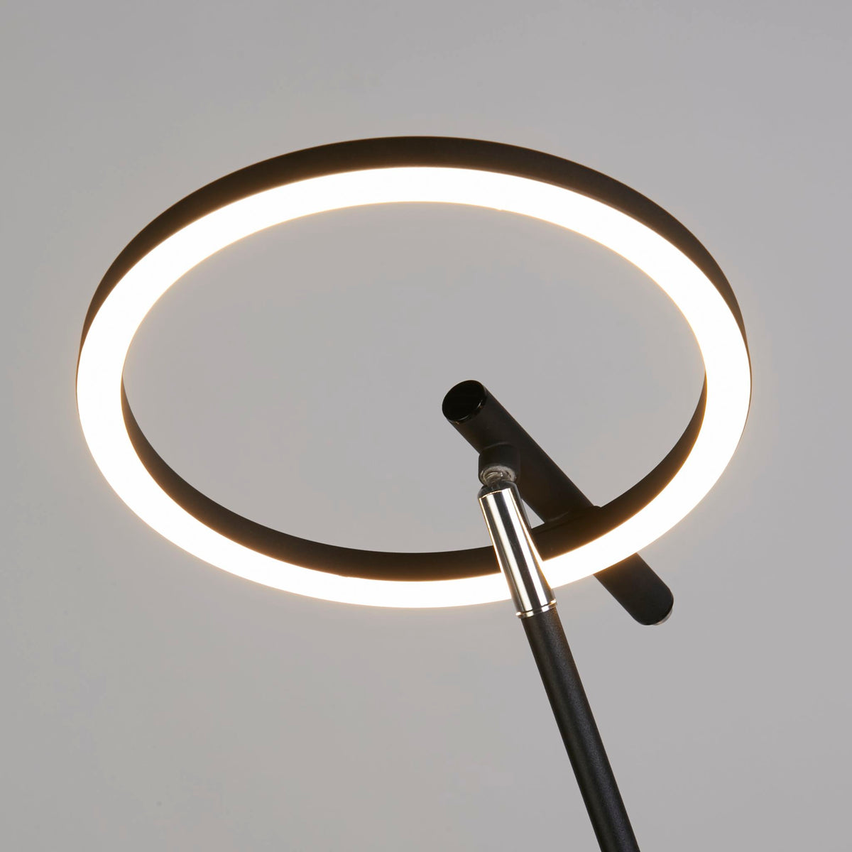 Close-up of Space glowing LED ring on its adjustable chrome and black joint