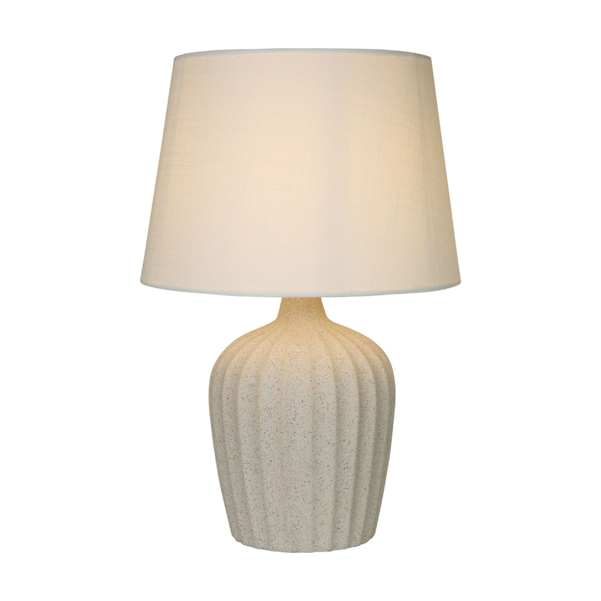 Padstow terrazzo table lamp lit with a ribbed speckled stone base and white fabric shade