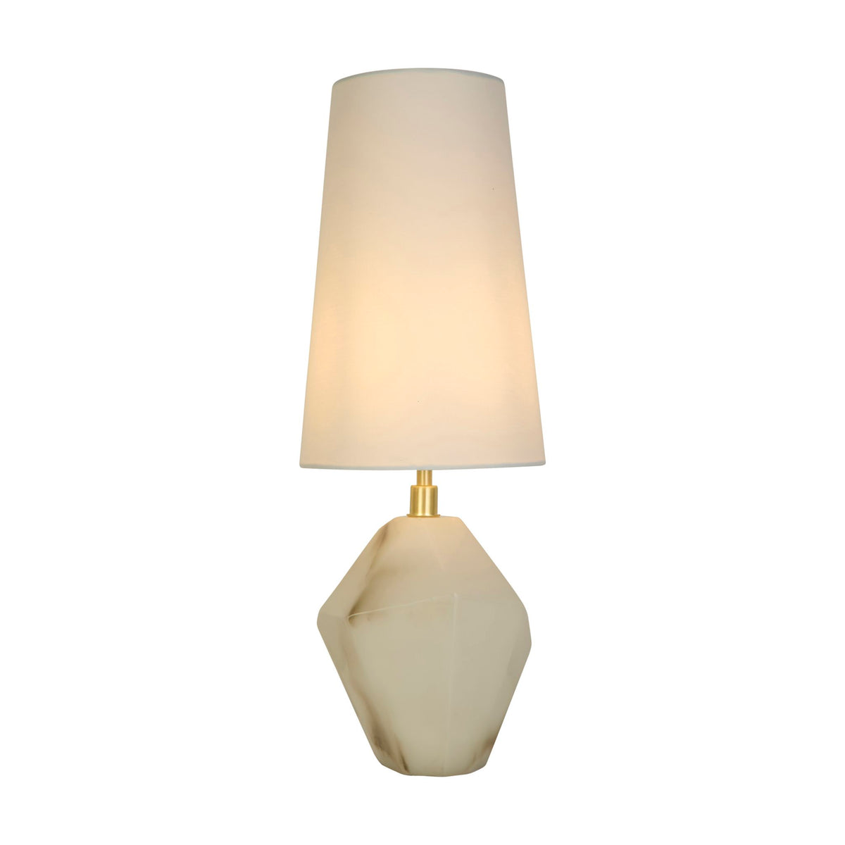 Apex satin brass table lamp lit with a faceted white resin base and tall tapered shade