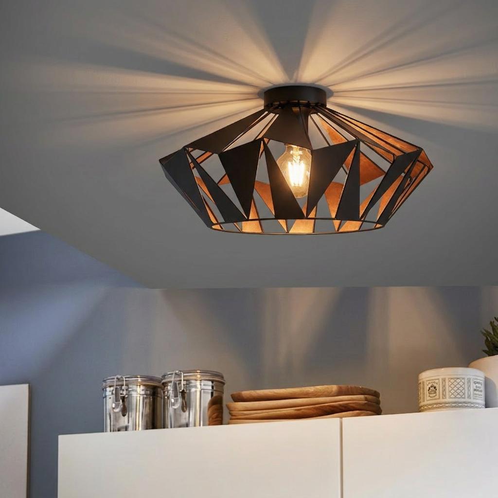 Eglo Carlton 6 geometric black and copper flush ceiling light casting shadow patterns in a kitchen.