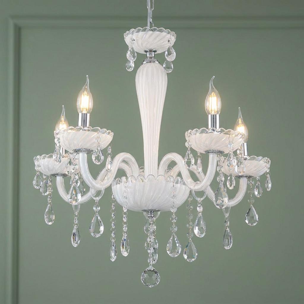 Elegant 5-light white glass chandelier with hanging crystals and chrome details against a sage green wall.