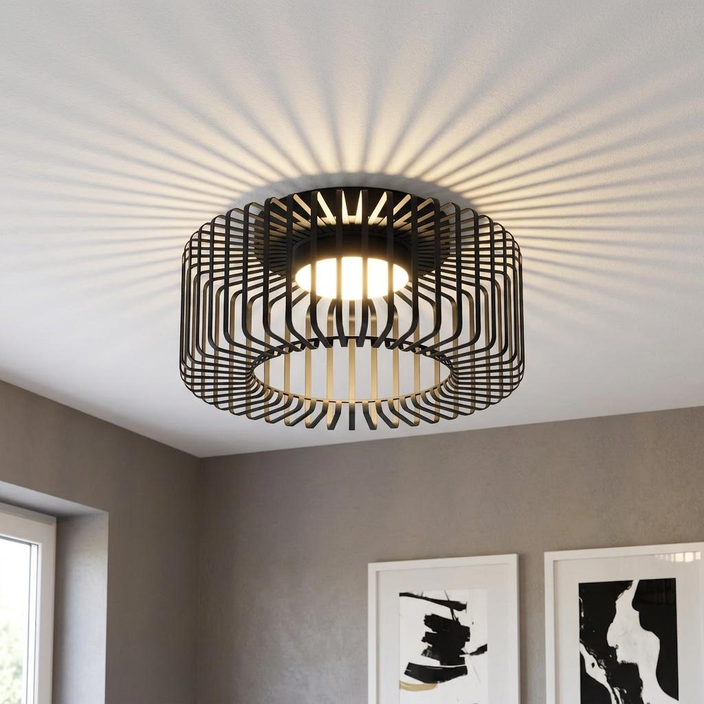 Modern black wire flush ceiling light casting radial striped shadows on a white ceiling in a contemporary room.