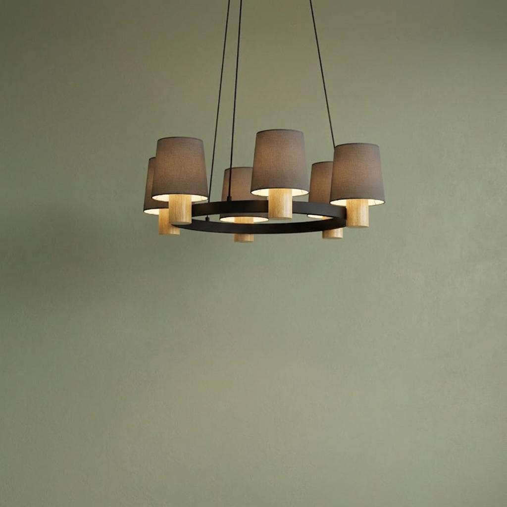 Eglo Edale pendant light with brown fabric shades and light wood bases on a black ring frame against a green wall.