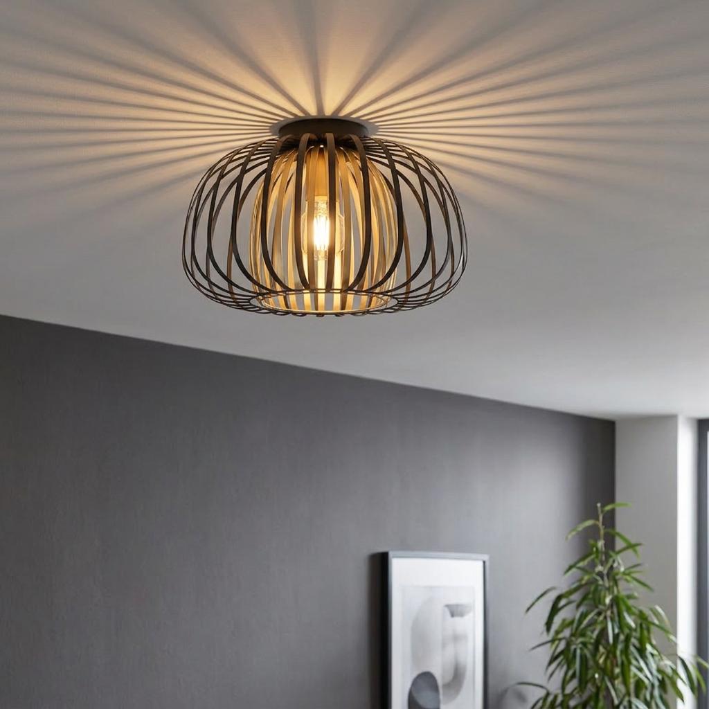 Brass and black metal strip flush ceiling light casting radial shadows across a white ceiling.