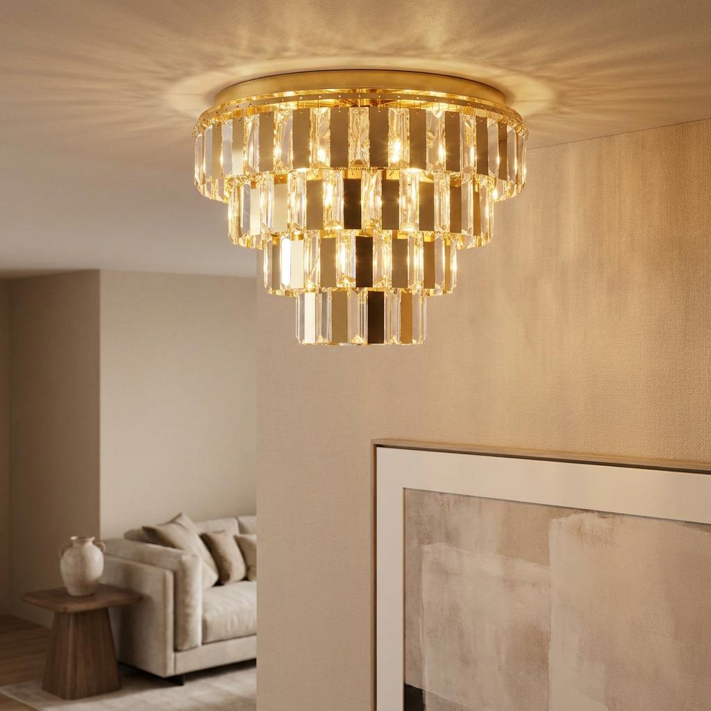A tiered brass and glass crystal flush ceiling light illuminating a contemporary living room with a warm glow.