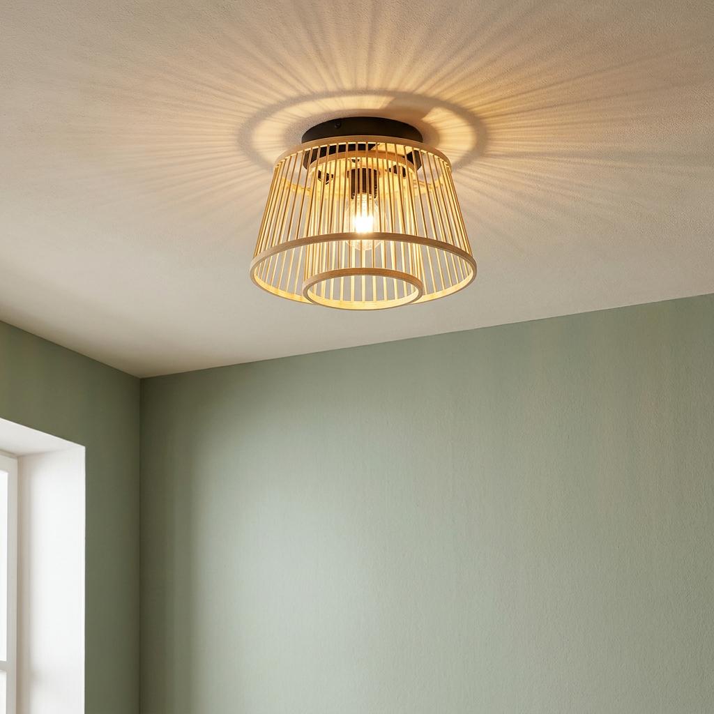 Eglo Hykeham natural wood flush ceiling light casting radial shadows on a white ceiling.