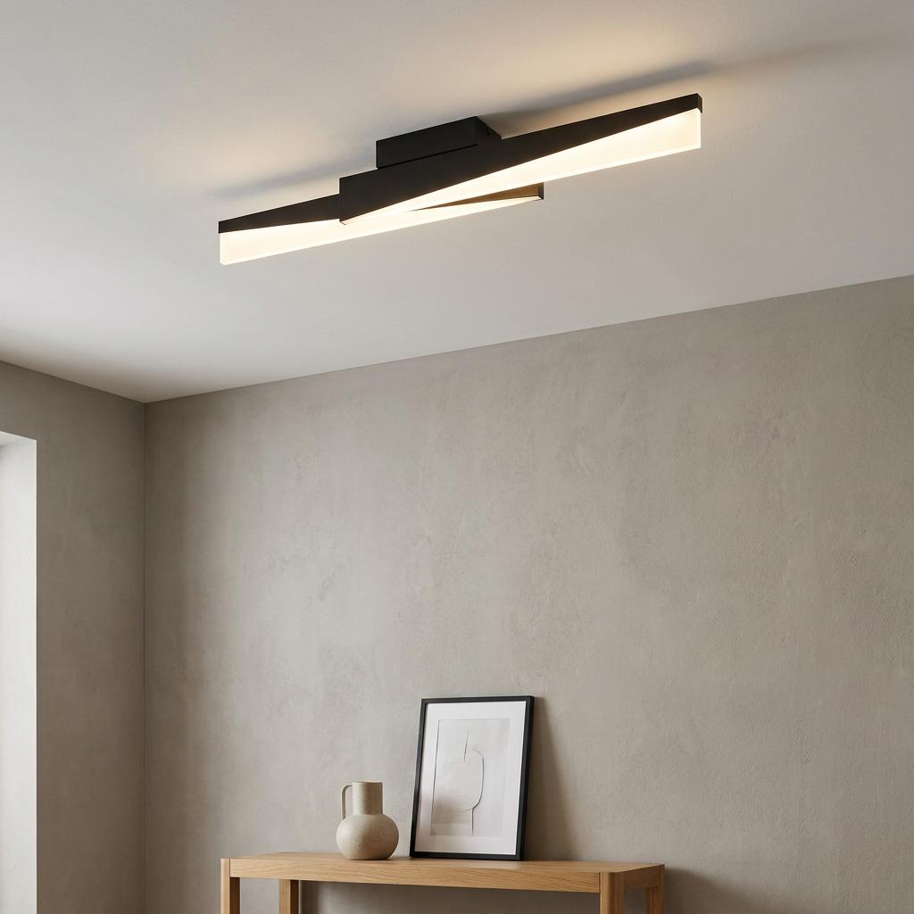 Modern black LED flush ceiling light with two intersecting glowing bars mounted in a minimalist room.