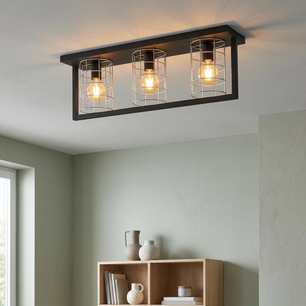 Eglo Jubily three-light ceiling flush with a black frame and silver wire cages in a modern interior.