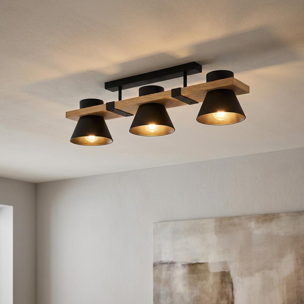 Three-light flush ceiling fixture featuring black conical shades and a natural wood beam mounted on a white ceiling.