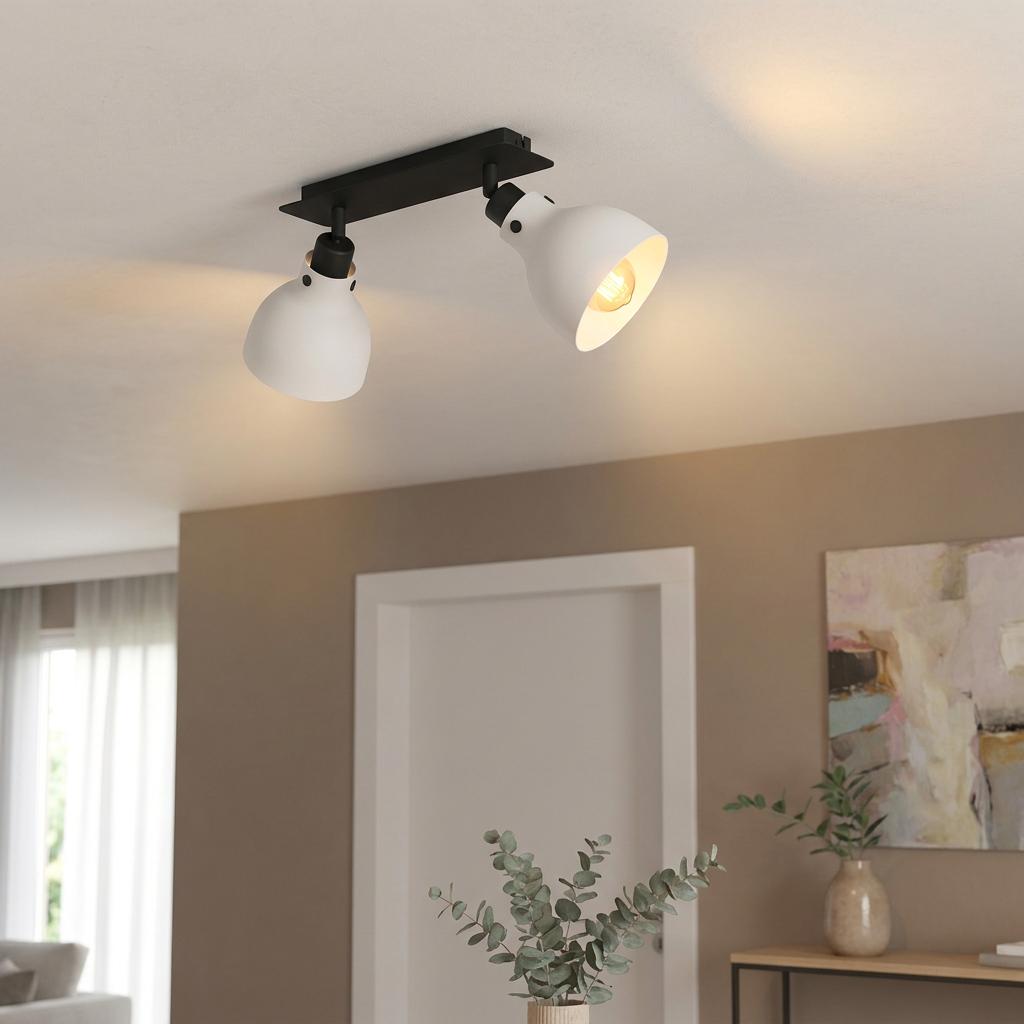 Eglo Matlock two-light bar spotlight with adjustable grey shades and a black base on a white ceiling.