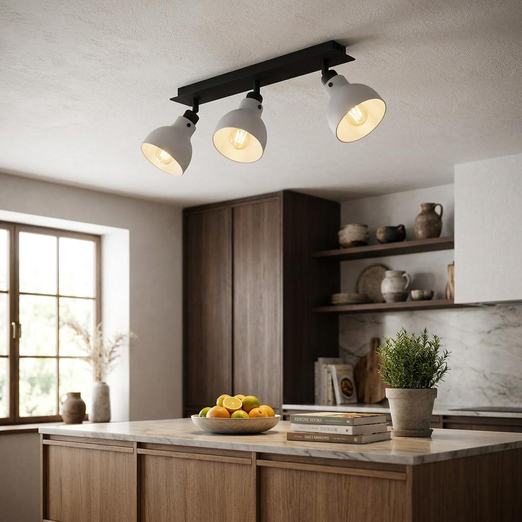 Eglo Matlock 3 light bar spotlight in black and grey mounted on a kitchen ceiling above a wooden island.