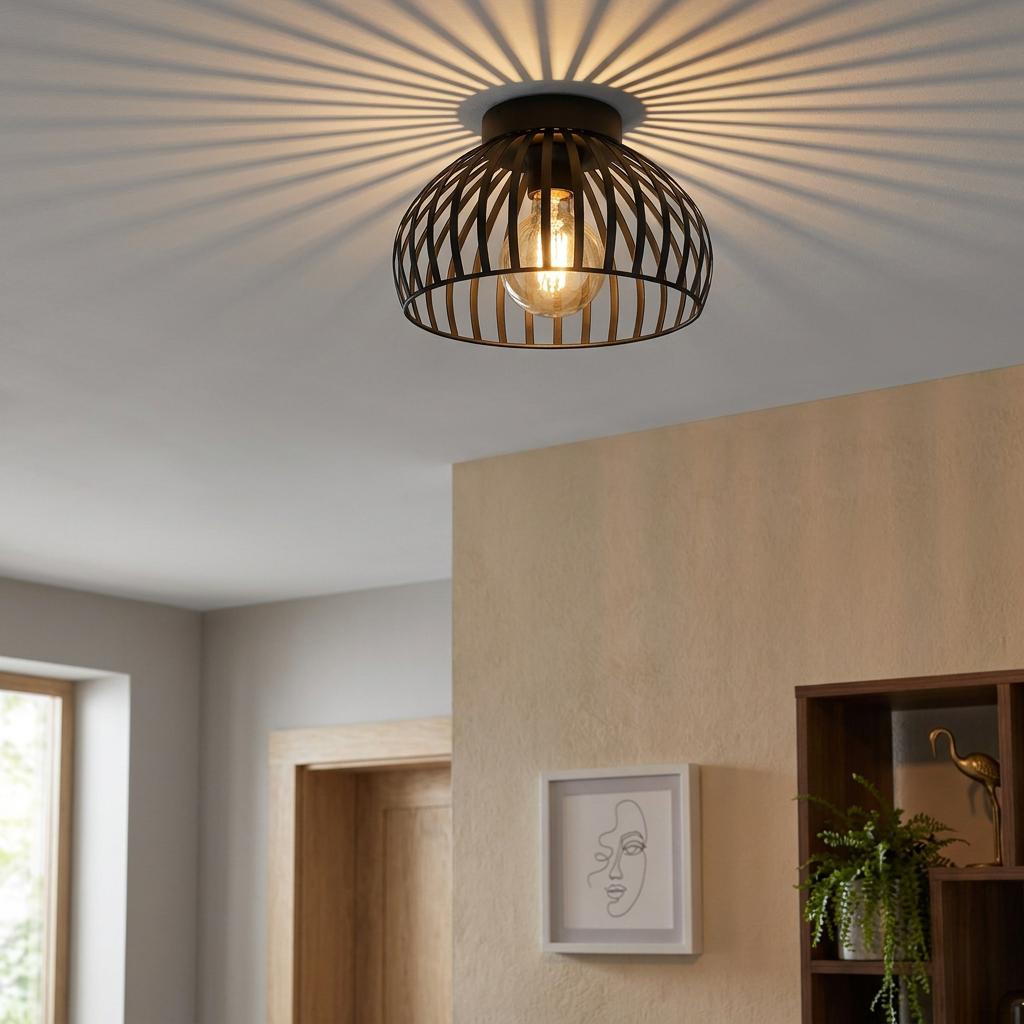Black wireframe flush ceiling light casting a radial shadow pattern in a modern interior.