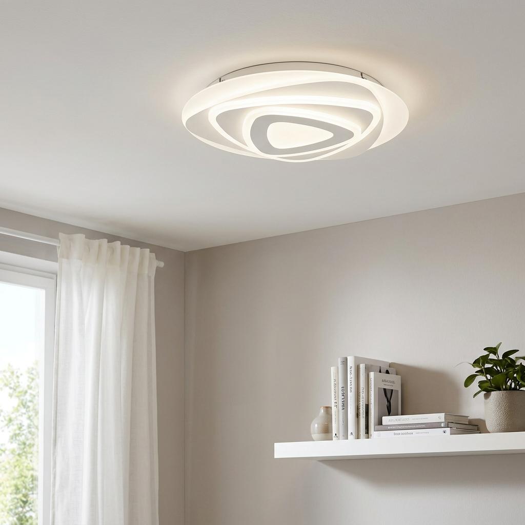 Modern white circular flush ceiling light with a swirling nested pattern illuminated in a minimalist room.