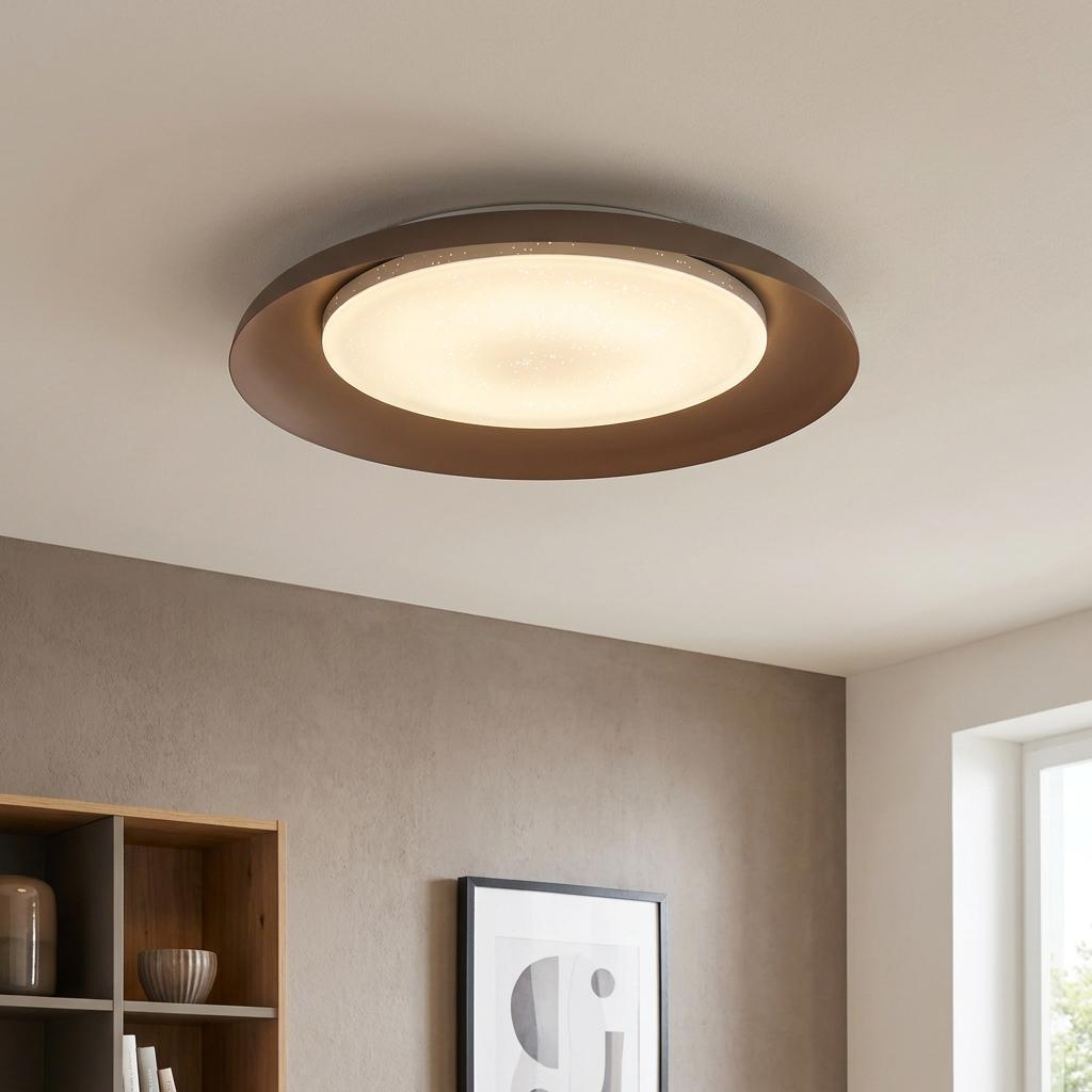 Modern round mocha LED flush ceiling light with a starry-effect diffuser in a contemporary living room.