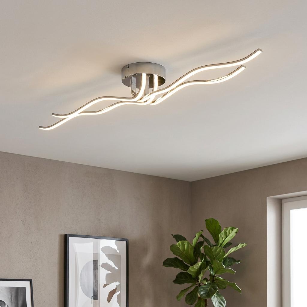 Eglo Roncade chrome ceiling flush light with two glowing curved LED bars in a modern neutral-toned interior.