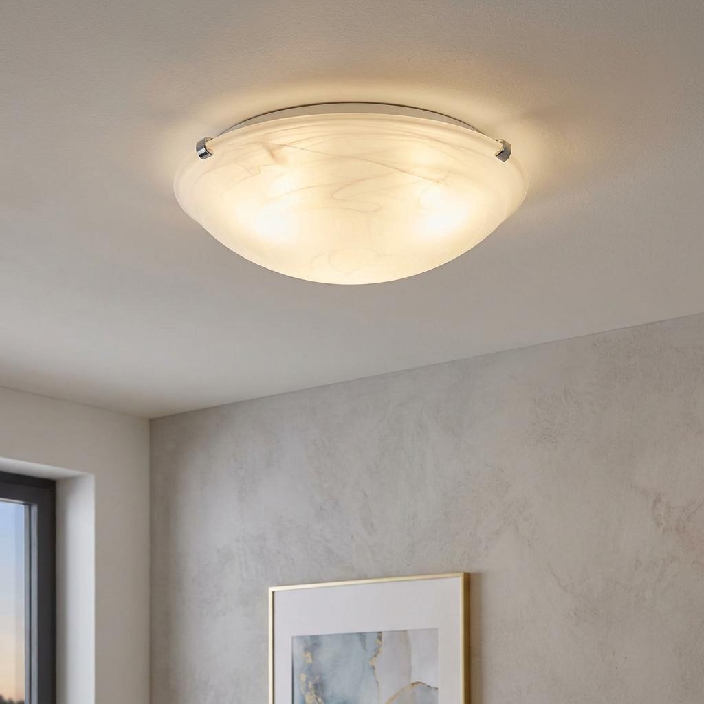 Eglo Salome white alabaster glass ceiling flush light mounted on a ceiling, emitting a warm glow.