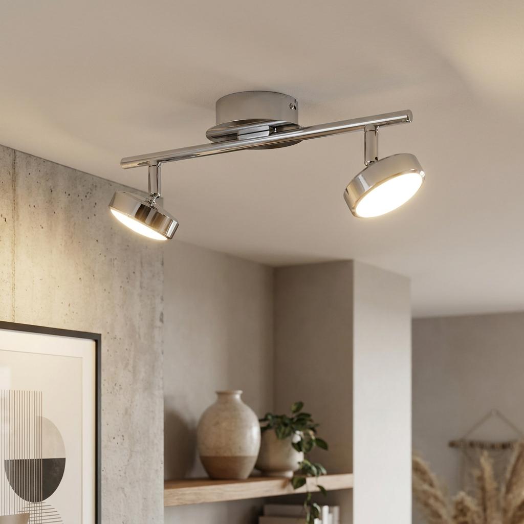 Illuminated Eglo Salto chrome 2-light bar spotlight mounted on a ceiling in a modern interior setting.
