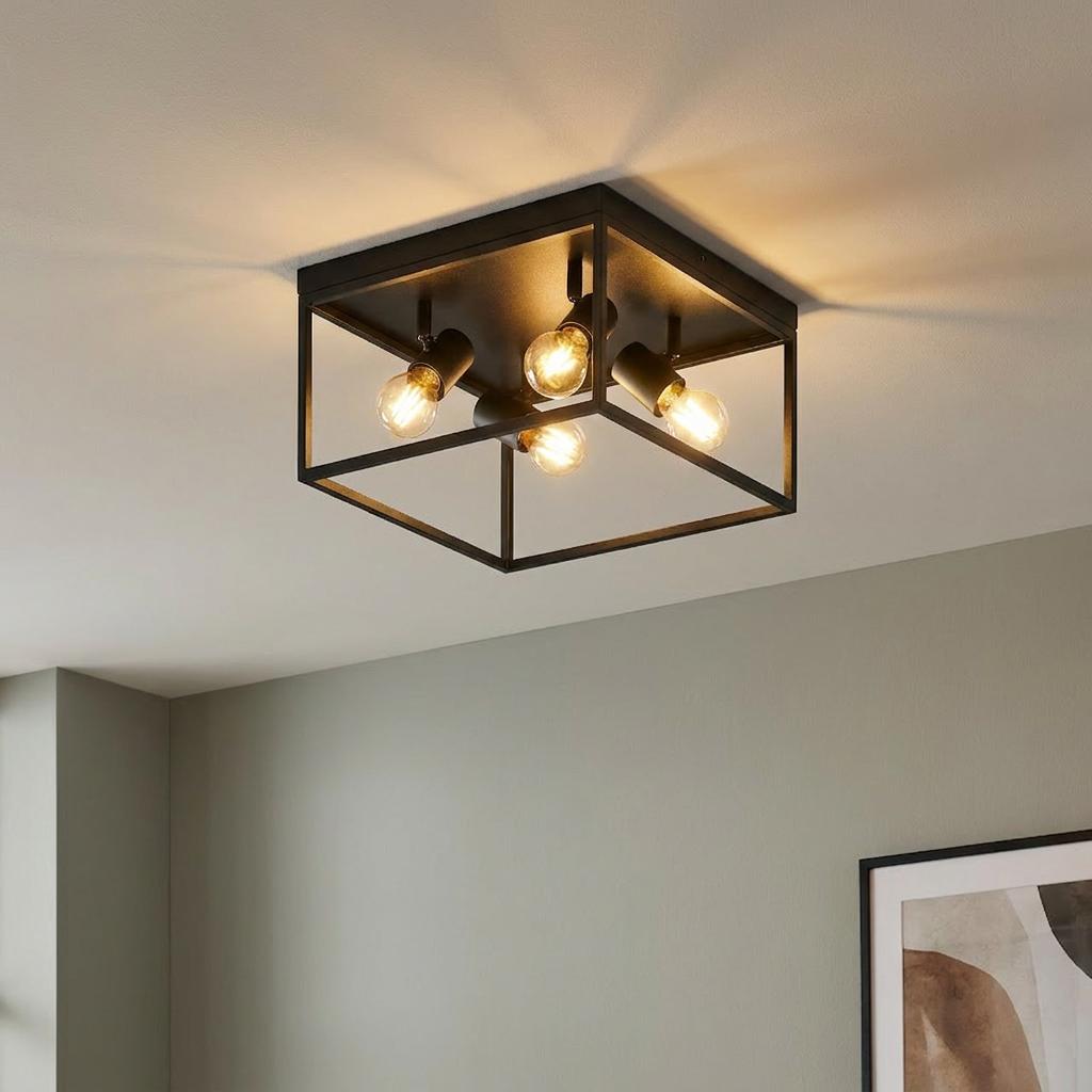 Eglo Silentina four-light black metal cage ceiling flush light with glowing bulbs in a neutral room.
