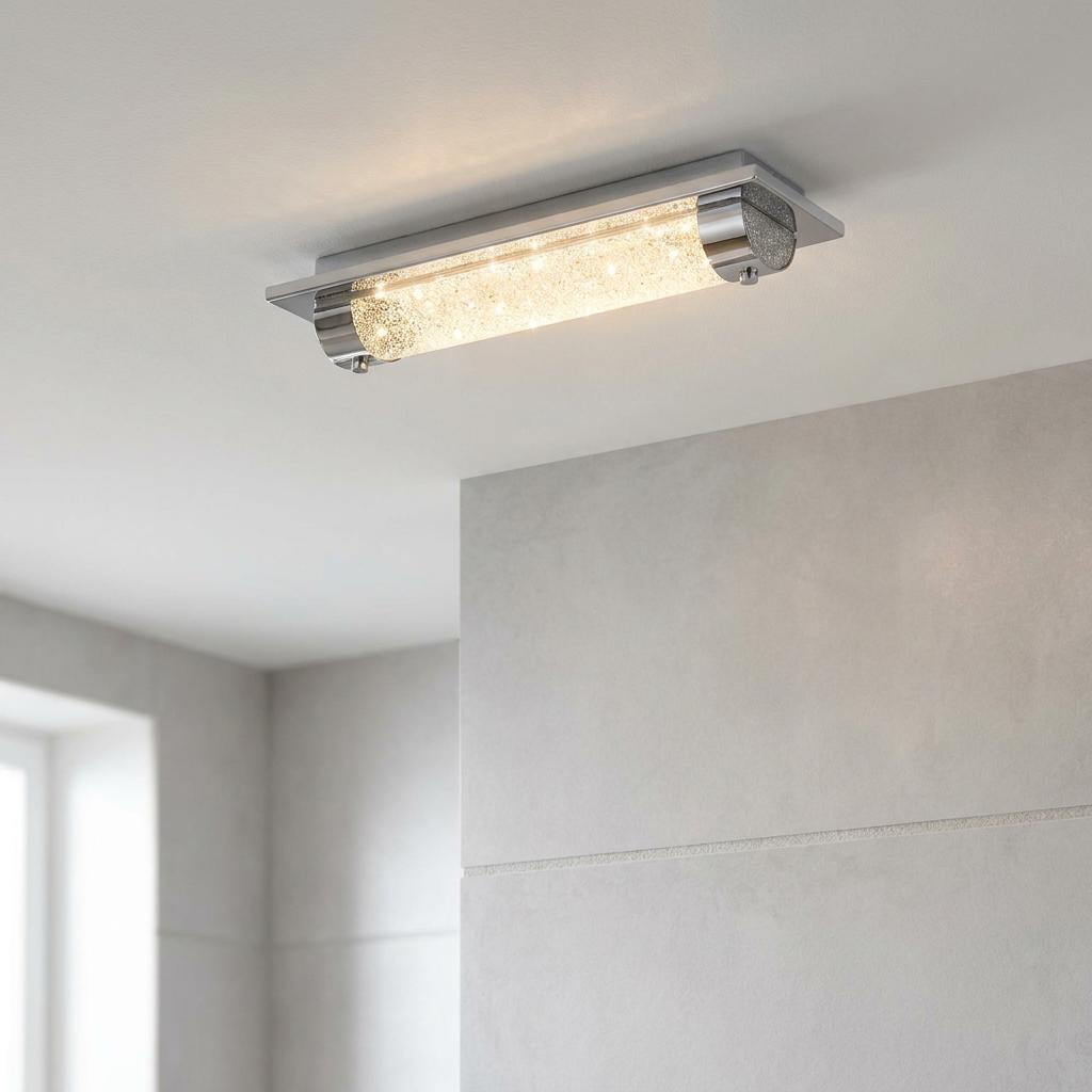 Modern chrome flush ceiling light with sparkling crystal beads mounted in a contemporary bathroom setting.