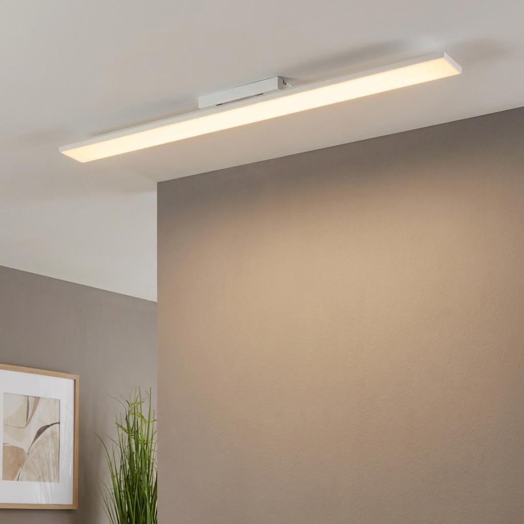 Rectangular warm white LED ceiling flush light mounted on a white ceiling in a modern living room.