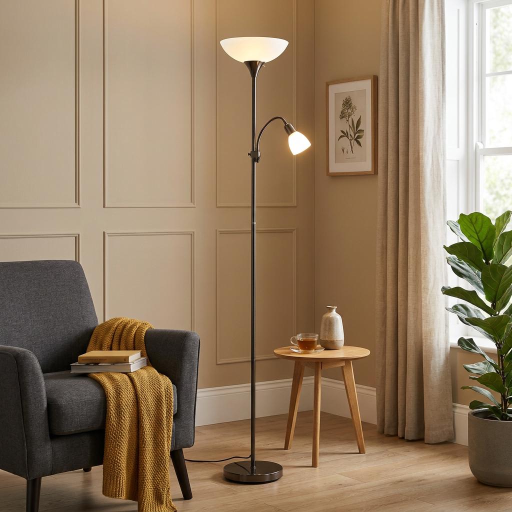 Eglo Up 2 floor lamp in black nickel with an uplighter and adjustable reading light in a cozy living room.
