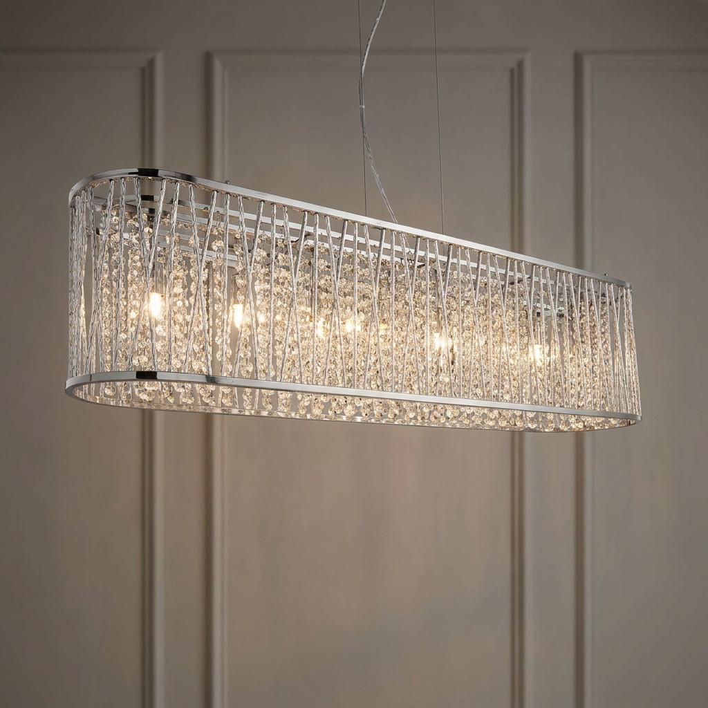 Elise 8 Light Chrome and Crystal oval pendant light with cascading crystal drops against a paneled wall.