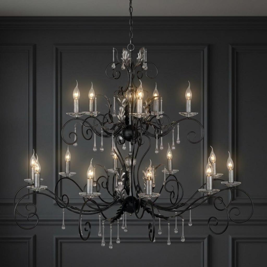 Ornate 15-light black and silver chandelier with leaf motifs and crystal droplets against a dark grey paneled wall.