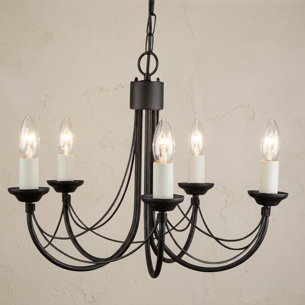 Five-light black wrought iron chandelier with candle-style bulbs and curved metal arms against a textured wall.