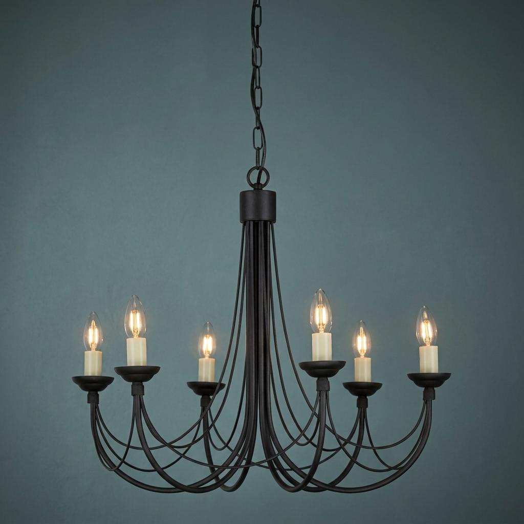 Elstead Carisbrooke 6-light black chandelier with thin curved metal arms and candle bulbs against a teal wall.