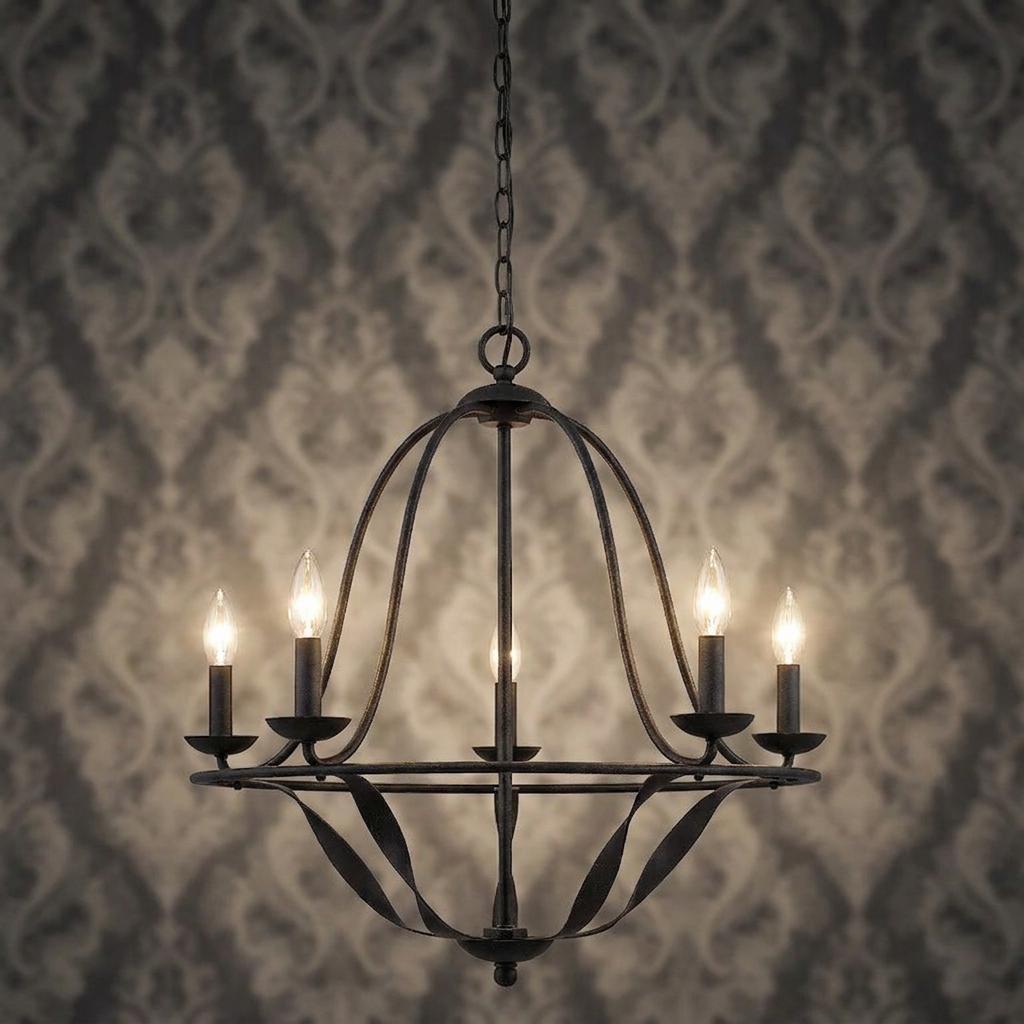 Five-light grey metal chandelier with curved cage arms and lit candle bulbs against a damask wallpaper background.