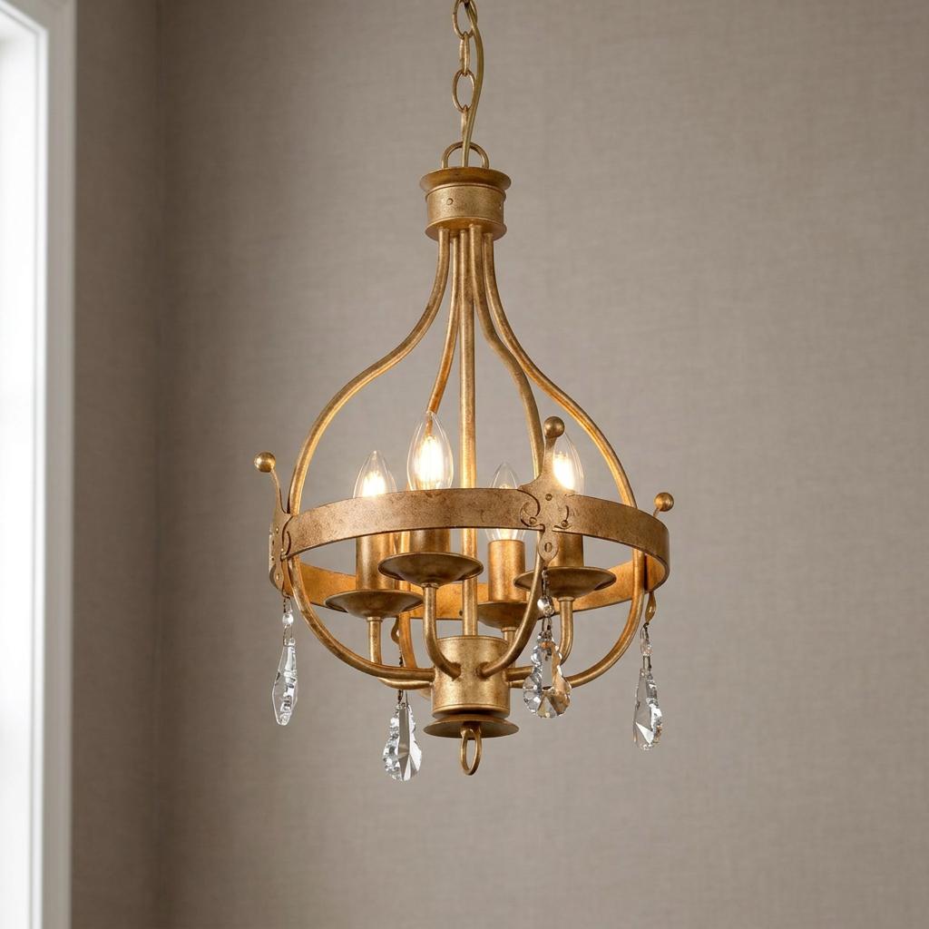Four-light gold patina pendant chandelier with an orb frame and hanging crystal droplets.