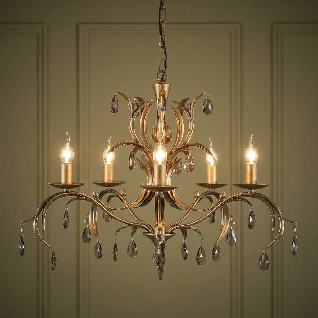 Elstead Lily 5-light bronze chandelier with lily-inspired metalwork and crystal droplets against a panelled wall.