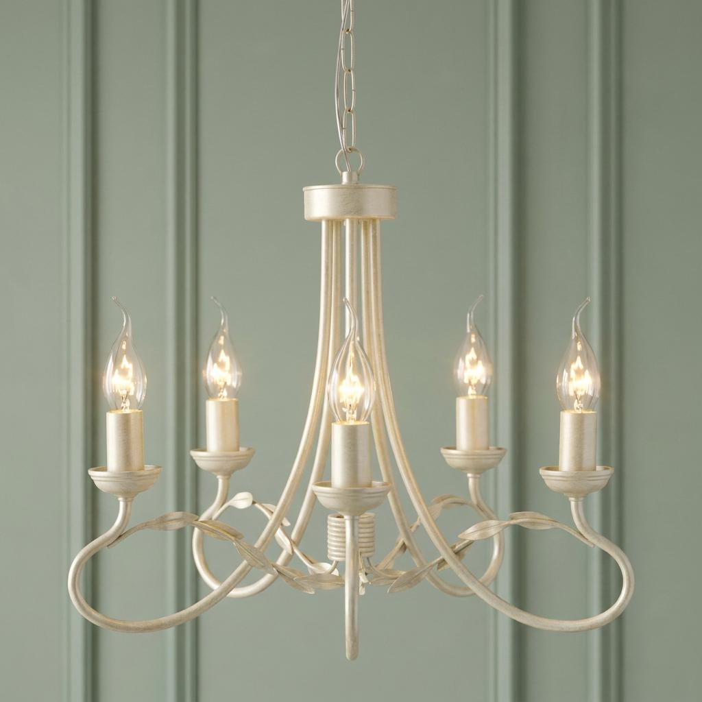 Elstead Olivia Ivory and Gold 5-light chandelier with leaf detailing against a green paneled wall.