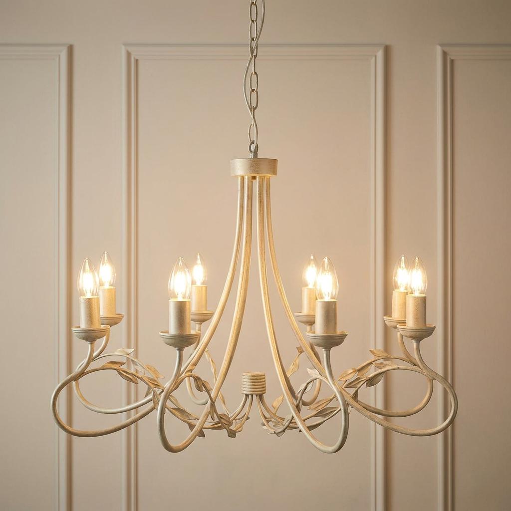 Elegant ivory and gold 8-light chandelier with leaf accents against a paneled wall.